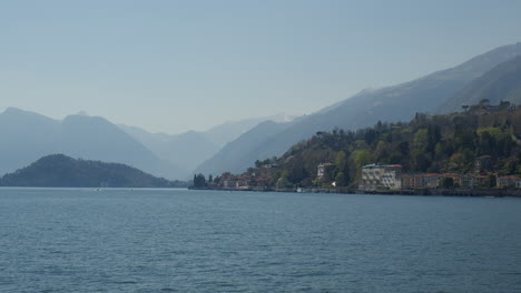 foggy mountain range near bellagio, lake como, lombardy italy