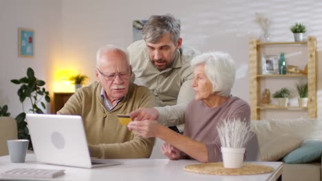 son helping his parents shop online