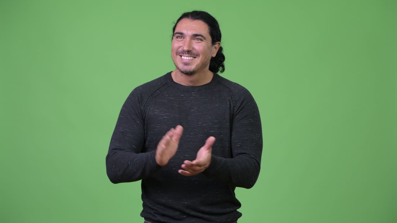 Happy handsome man clapping hands