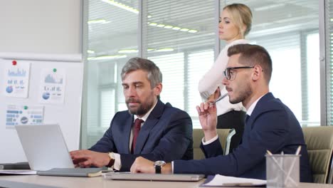 businesspeople discussing work in meeting room