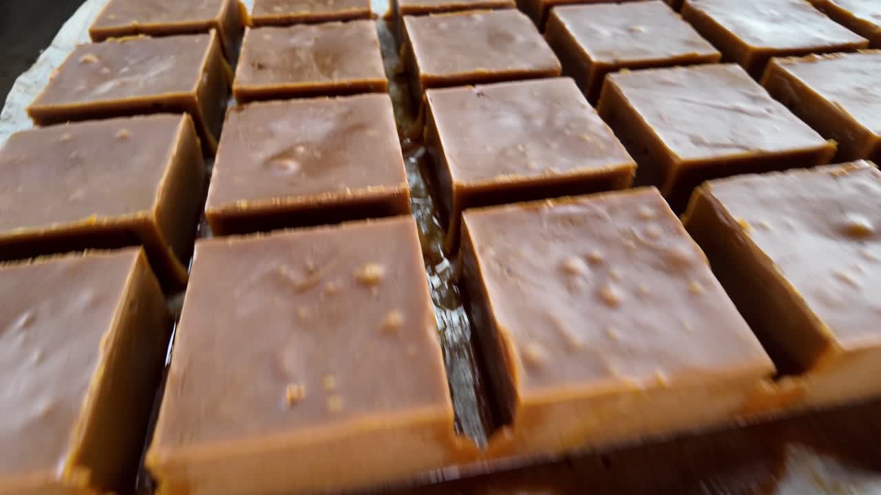 Handmade brown sugar blocks from Venezuela, rich texture and artisanal process shown