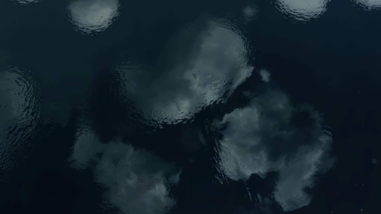Showing dark water shifting cloud reflections, rippling from light wind at dusk with highlights