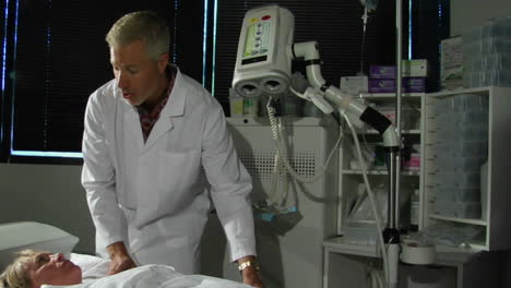 a doctor prepares a patient for a cat scan 1