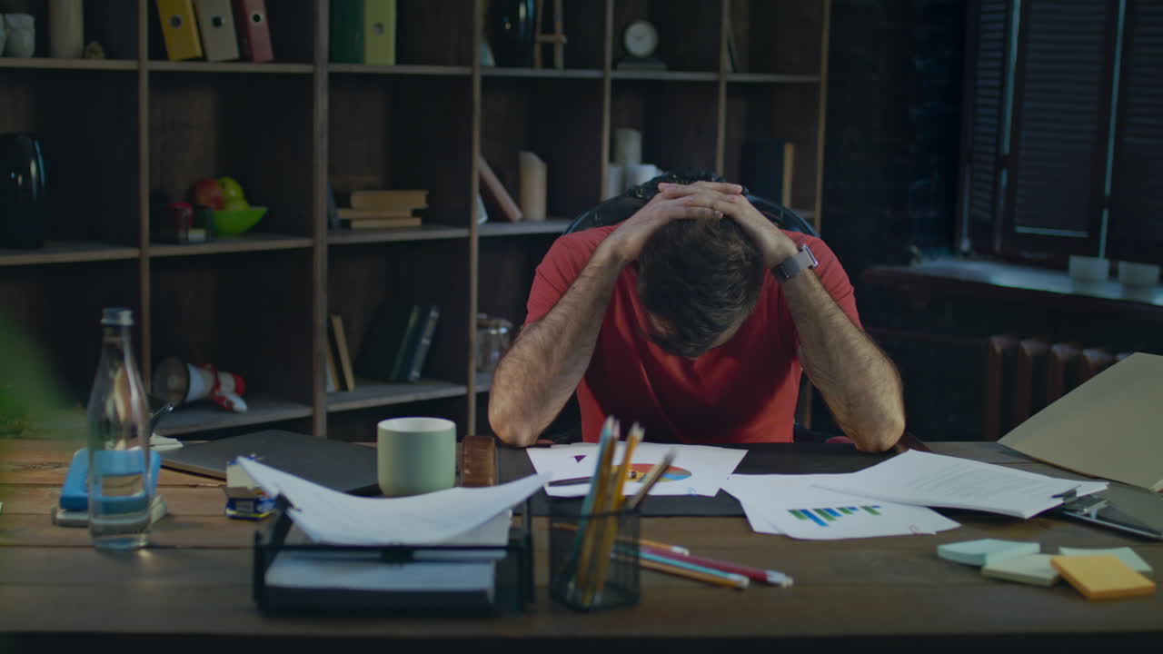 Upset business man putting hands on head. Depressed man thinking about business
