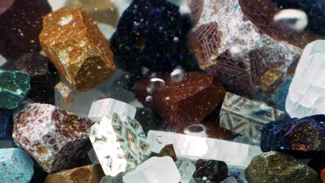a captivating underwater view of colorful crystals and precious stones glimmering amidst bubbles and swirling water in a stunning display