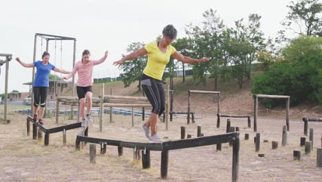 female friends enjoying exercising at boot camp together