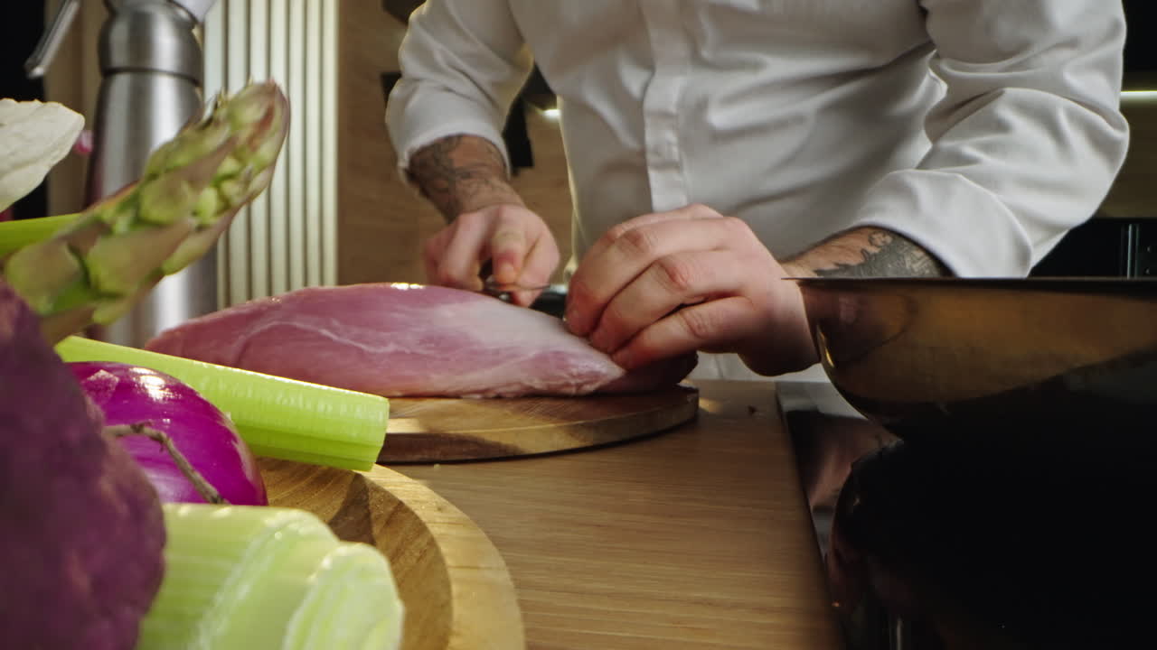 Chef preparing meat and vegetables