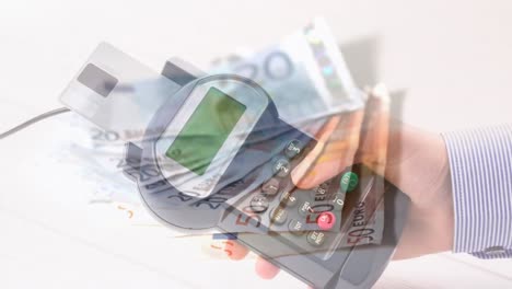 animation of euro banknotes falling over hand of caucasian man holding payment terminal