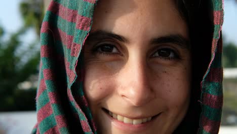 close up portrait of young arab woman in a headscarf