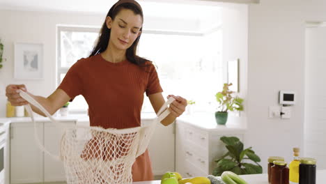 arranging fresh fruits and vegetables, woman preparing healthy meal on kitchen counter