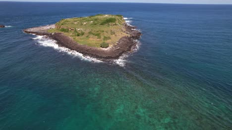 flying towards cook island in nsw, australia - drone shot