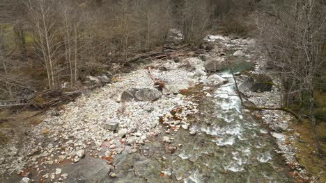 fly through drone shot along maggia river, flowing down from cristallina mountain, located in cavergno village in the district of vallemaggia, in the canton of ticino, switzerland