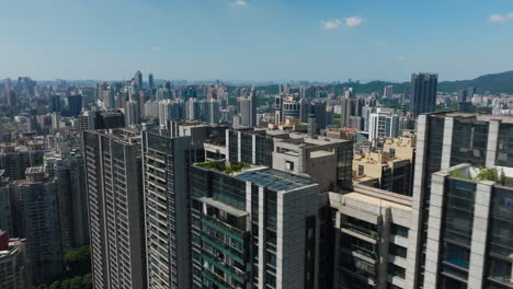 modern skyscrapers in downtown guangzhou with a clear sky backdrop, aerial view