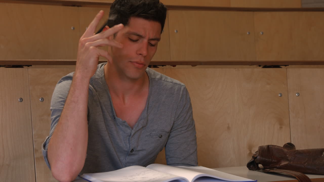 Student taking notes in lecture