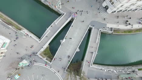 Aerial-view-of-Tromostovje,-Triple-Bridge-of-Ljubljana-on-the-river-Ljubljanica,-center-of-the-city