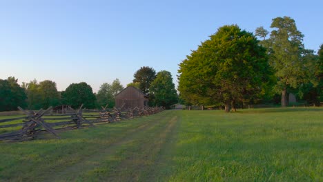 Drone-aerial-of-the-Joseph-Smith-family-farm,-frame-house,-barn-and-the-sacred-grove-in-Palmyra-New-York-Origin-locations-for-the-Mormons-and-the-book-of-Mormon