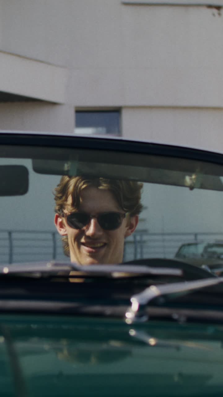 Man driving a convertible in the city