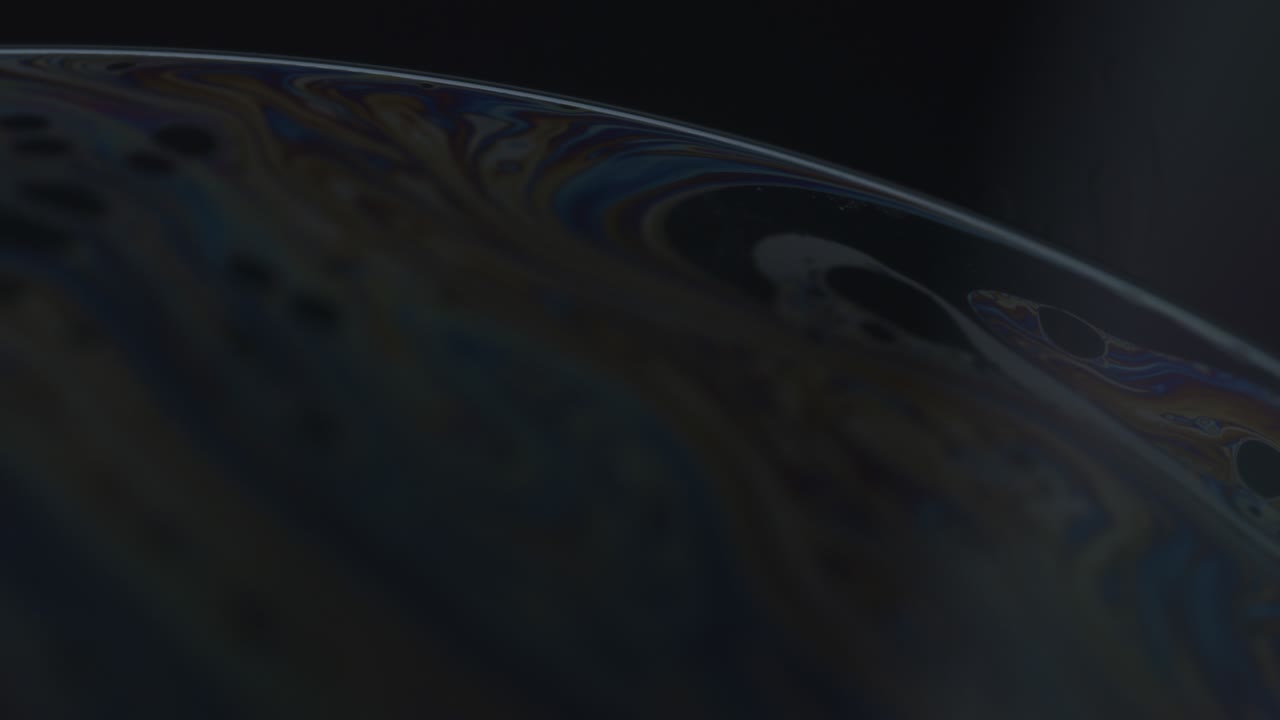 Macro Abstract Shot of Soap Bubble In  Dark Background