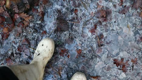 feet in boots walk in the sulfur mud, slow motion close up shot