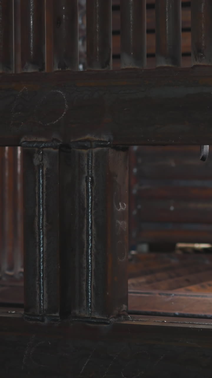 Cube of welded metal tubes for installation in boiler mechanical room in workshop closeup. Hot water flow delivering system in semidark storehouse
