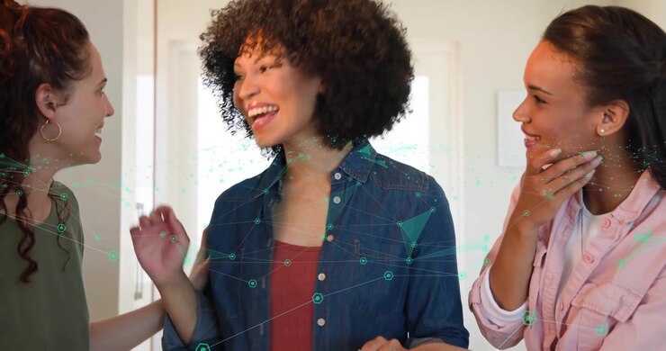 Women reacting to good news in kitchen with floating hearts around woman sharing health support
