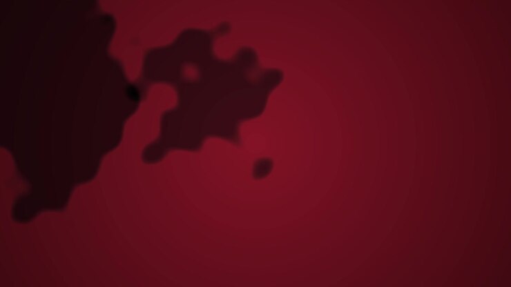 Liquide rouge abstrait se propageant sur fond noir