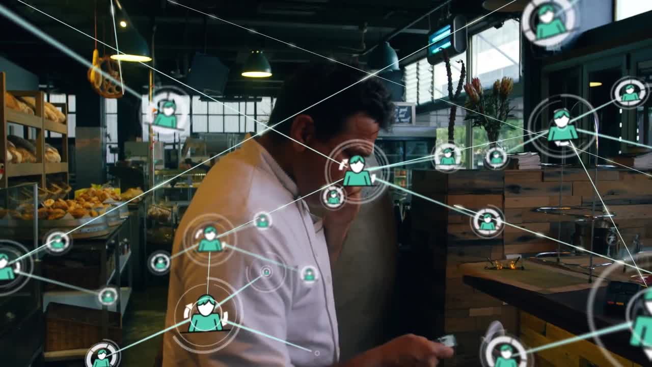 Animation of network of connections with people icons over biracial businessman using smartphone