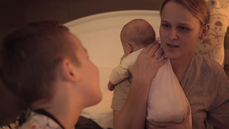 mother spending time with children at home