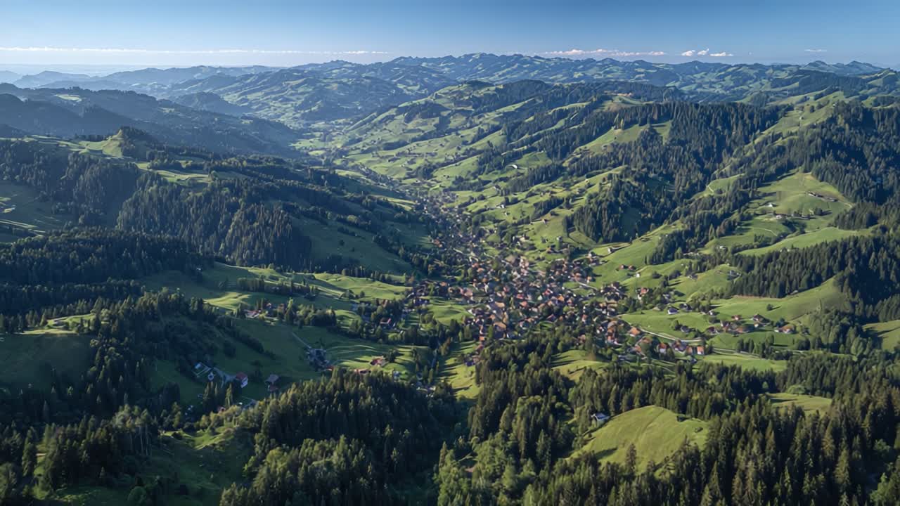 Breathtaking Aerial View of a Serene Valley Surrounded by Majestic Mountains and Lush Green Hills, Showcasing a Quaint Village Nestled Amongst Nature's Splendor