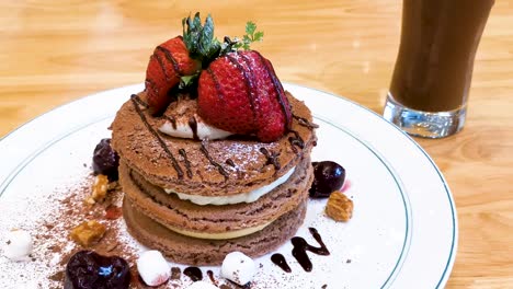 souffle pancake, chocolate flavor with strawberry, japanese style in hong kong cafe restaurant