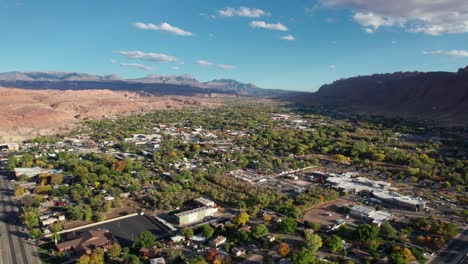 high elevation drone shot of moab, utah on a sunny day in the fall