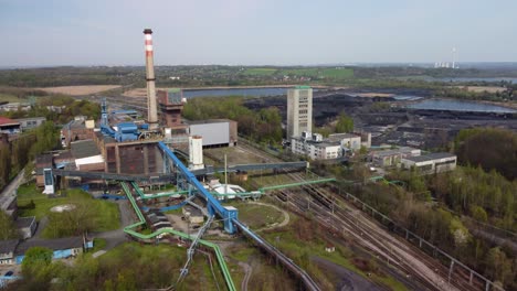 Old-coal-mine-elevator-and-piles-of-slag-behind-in-Karvina-on-a-sunny-day