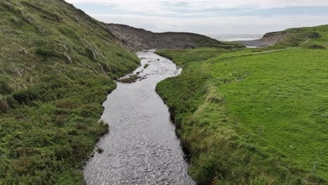 aerial following river in countryside