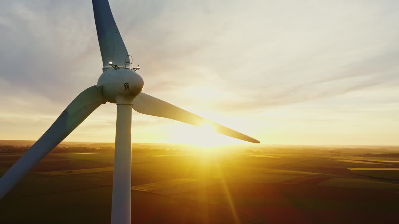 Wind Turbine at Sunset over Farmland