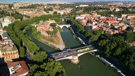 aerial pullback reveals tiber island on beautiful summer day in rome, italy