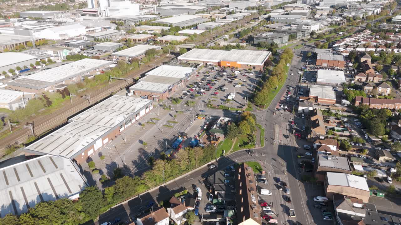 Aerial view of partially vacant retail park showing commercial units and parking facilities in Slough, Berkshire, UK, October 2024