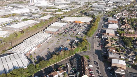 aerial view of partially vacant retail park showing commercial units and parking facilities in slough, berkshire, uk, october 2024