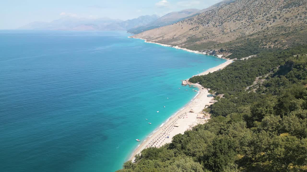 Drone pullback hides the amazing coastline of the Albanian Riviera
