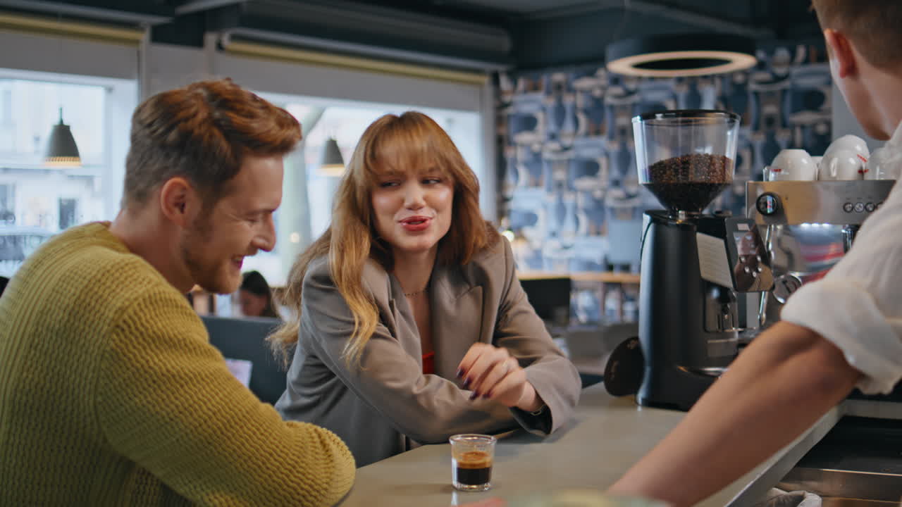 Office workers talking bartender drinking coffee at business building closeup