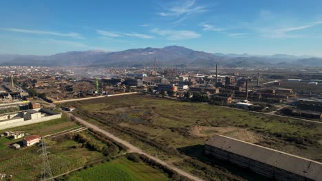 Smoke-rising-from-the-chimneys-of-the-furnaces-on-metallurgic-factory-industrial-zone-in-Elbasan,-Albania