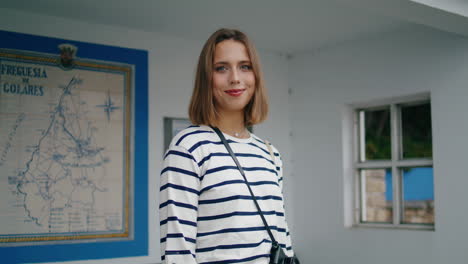 Girl-posing-bus-stop-closeup.-Beautiful-smiling-tourist-waiting-public-transport