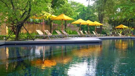 umbrella and pool bed decoration around swimming pool in hotel resort