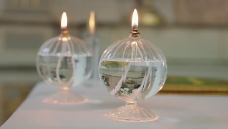 elegant glass oil lamps with soft flames flickering, adding a warm ambiance to the space