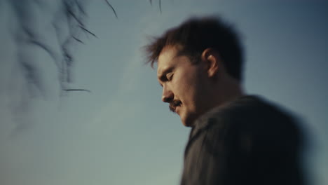 contemplative portrait of a man with a mustache