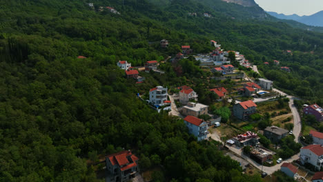 aerial pull back away from a modern villa, in the mountains of montenegro