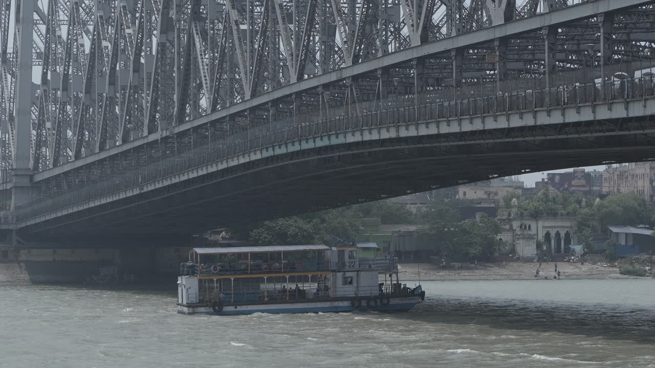 Ferry Boat on Hooghly River Under Howrah Bridge in Kolkata, India