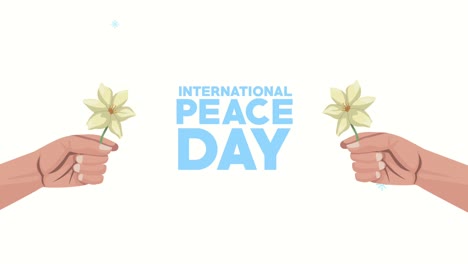 international peace day lettering with hands lifting flowers