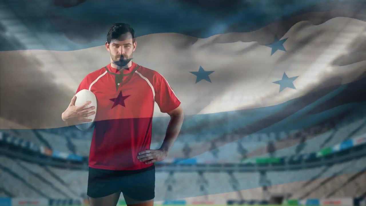 jugador de rugby profesional de pie frente a una bandera y un estadio