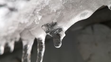 Slow-motion-scene-of-ice-melting-on-the-roof-of-a-house