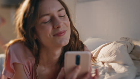 attractive woman talking cell in sunlight closeup. smiling girl hang up call